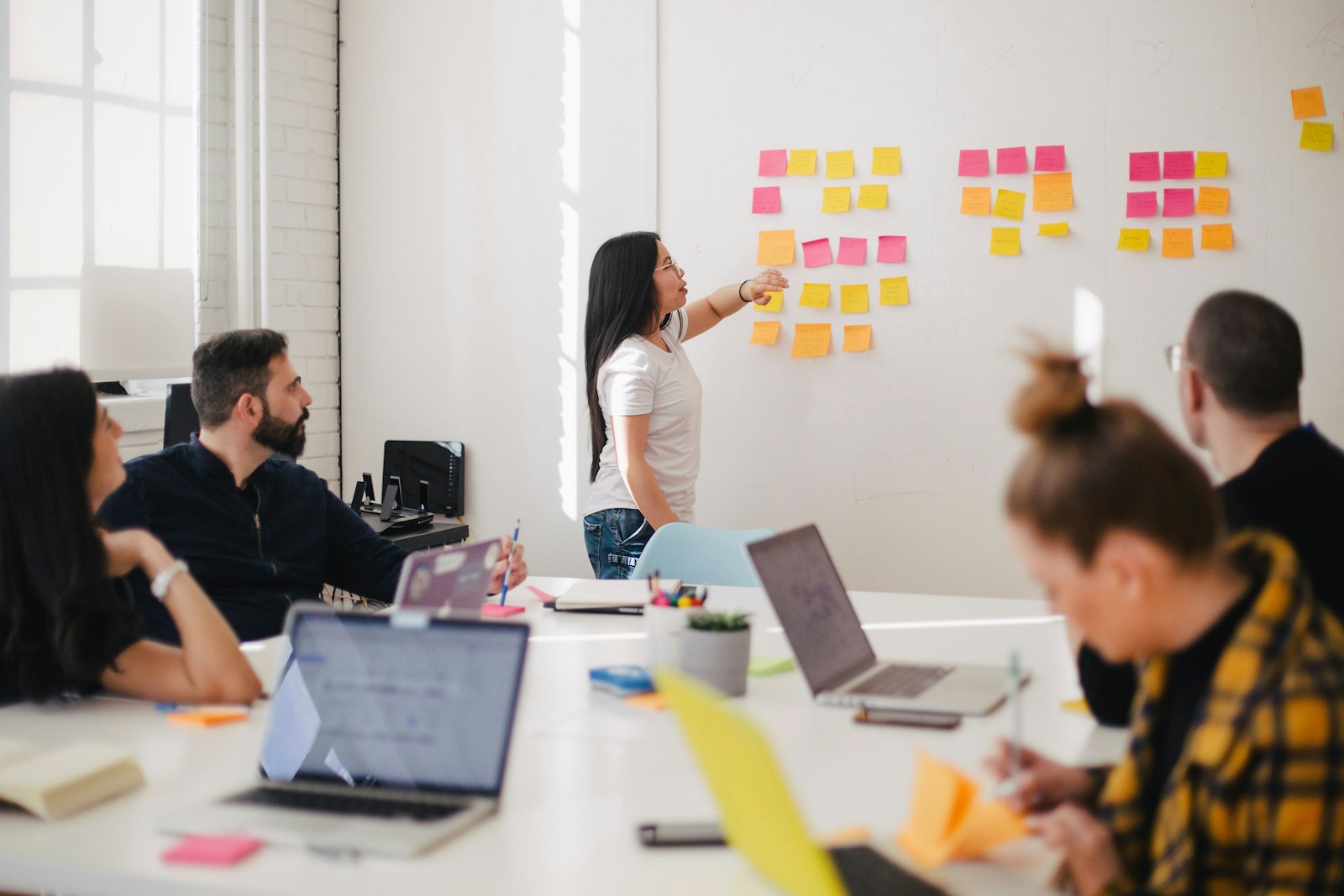 Channel planning session with marketing calendars and cross-channel strategy boards